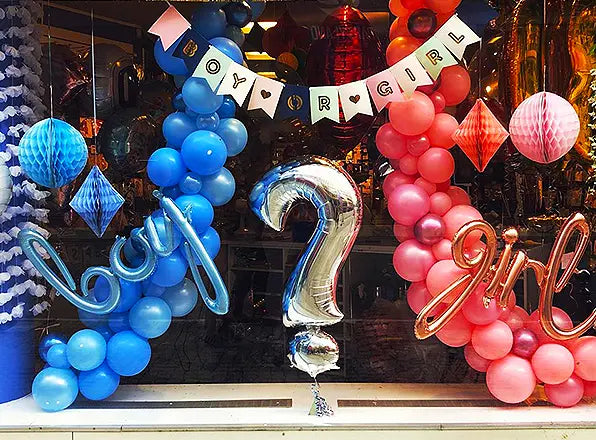 Photobooth huren voor gender reveal of babyshower: feestelijke blauw-roze ballondecoratie met boy-or-girl thema